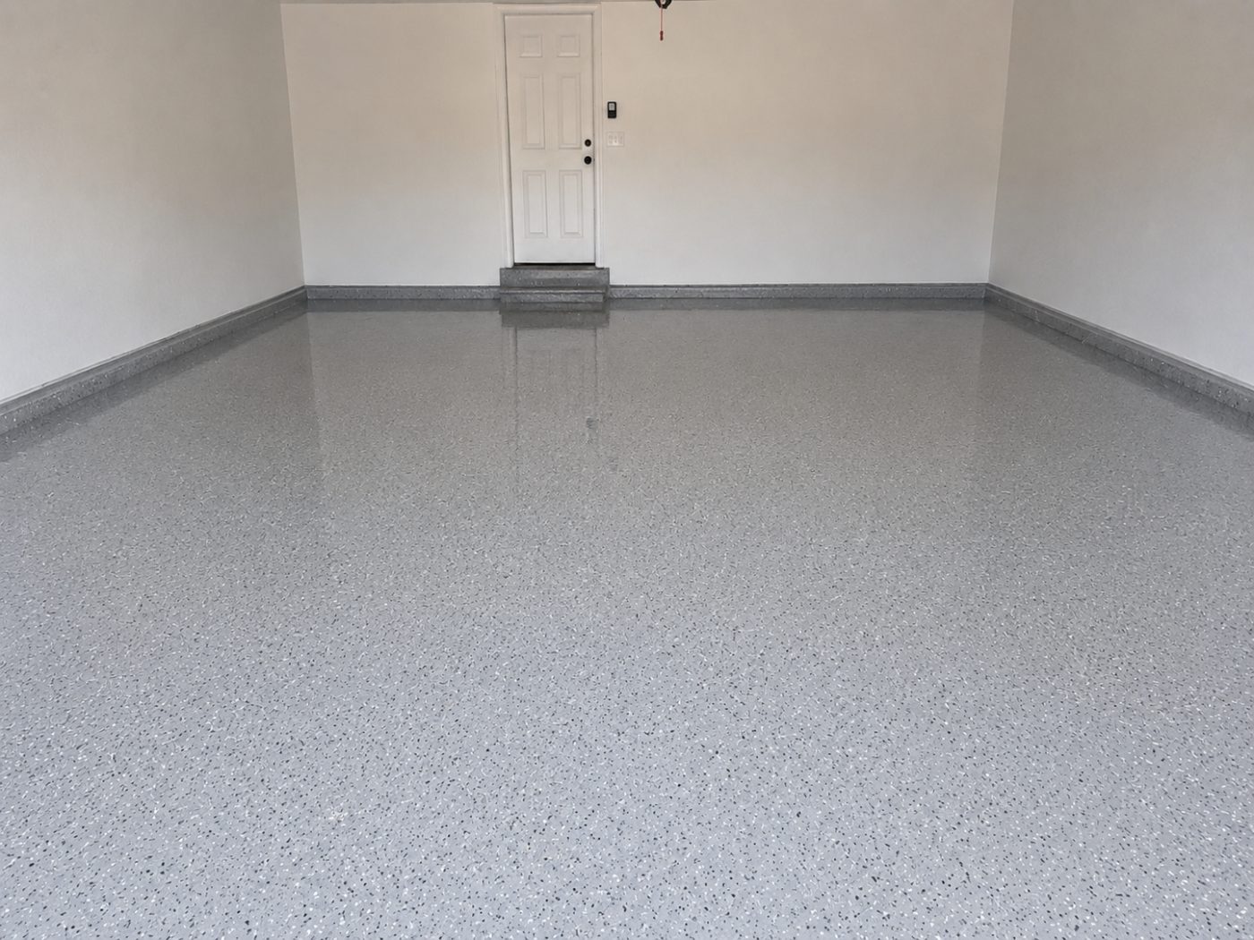 Light grey flake epoxy garage floor after