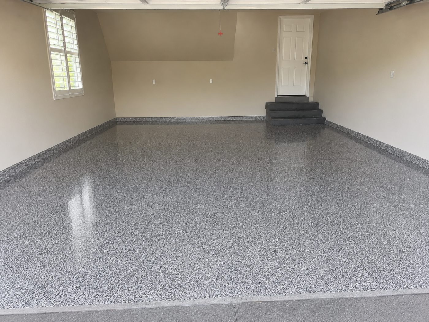 Grey flake epoxy garage floor after